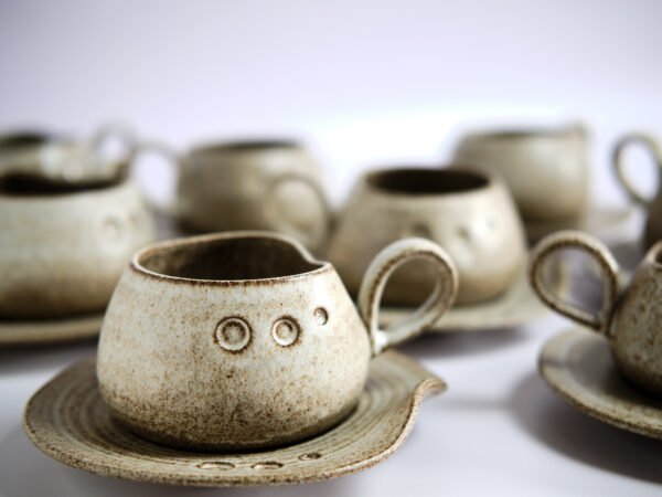 Hanfd made ceramic mug with saucer