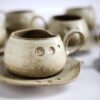 Hand made ceramic mug with saucer.