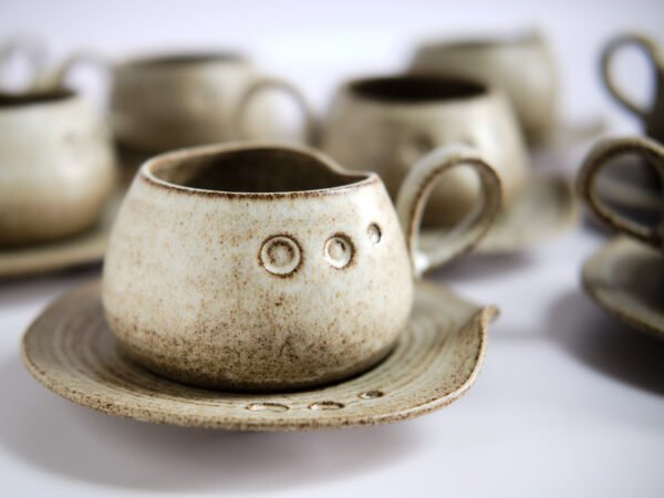 Hand made ceramic mug with saucer.